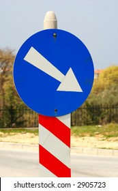 Blue sign with arrow pointing right