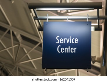 Blue Signage Marks The Customer Service Center In A Public Building Shopping Structure