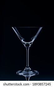 Blue Silhouette Of Martini Glass On Black Background