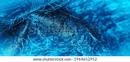 Blue silk fabric, woven threads on fabric, fluffy effect. Background texture, decorative ornament
