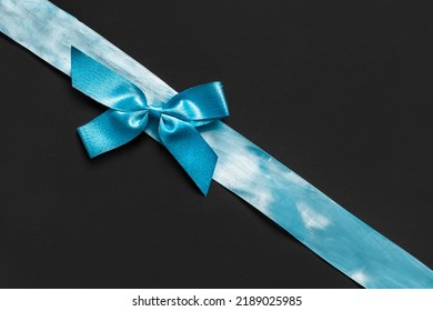 Blue Silk Ribbon Tied Bow On Black Background