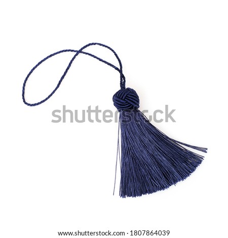 Blue silk tassel isolated on white background for creating graphic concepts