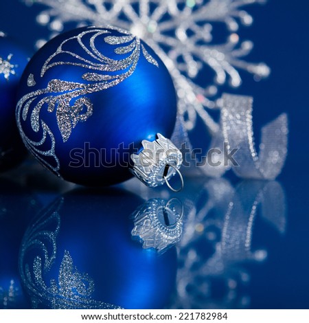 blue and silver christmas ornaments on dark blue xmas background with space for text - Blue And Silver Christmas Ornaments blue and silver christmas ornaments on dark blue xmas background with space for text - Blue And Silver Christmas Ornaments