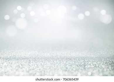 Blue And Silver Glitter Lights Bokeh Abstract Background Holiday. Defocused.