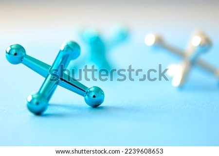 Blue and silver jacks in macro view with limited focus
