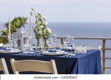 Blue And Silver Romantic Wedding Table Top Layout Table Spread No People No Human Tropical Location With The Sea And Clouds In The Background