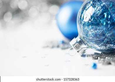 Blue And Silver Xmas Ornaments On Bright Holiday Background With Space For Text. Merry Christmas!