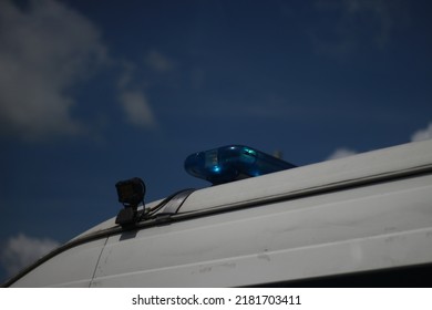 Blue Siren Light, White Hospital Car