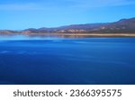 Blue Skies and Mountain by Roosevelt lake in Central Arizona