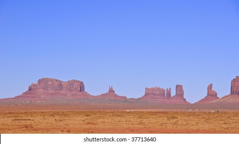  Blue skies over Monument Valley in Utah - Powered by Shutterstock