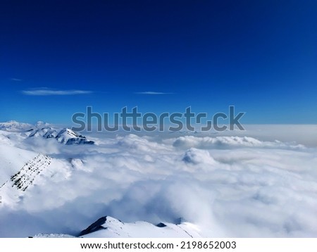 blue sky above clouds. above mountain