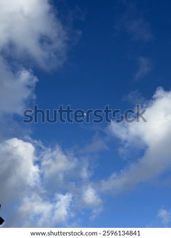 Blue sky after raining with fluffly clouds and moon
