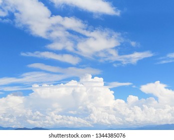 Blue sky background with clouds - Shutterstock ID 1344385076