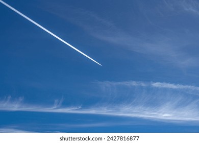 Blue sky Background and Jet contrails - Powered by Shutterstock