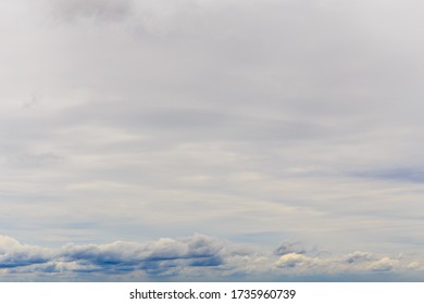 blue sky background with tiny clouds