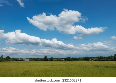 Blue sky background with a tiny clouds	
