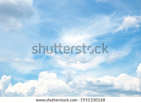 blue sky background with tiny clouds