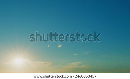 Blue Sky Background With Tiny Clouds. Low Angle View. Blue Clear Sky And White Clouds.
