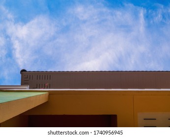 Blue sky background with white clouds. The sky and the building
