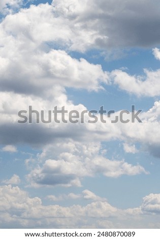 Blue sky background, white clouds in the sky.