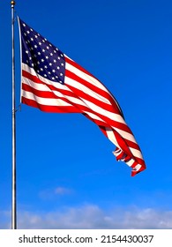 Blue Sky Behind ￼giant American Red Whit And Blue Flag