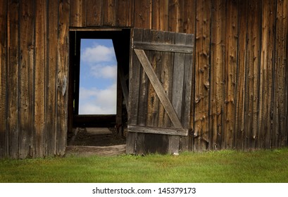 Blue Sky Behind A Barn Door In Wood