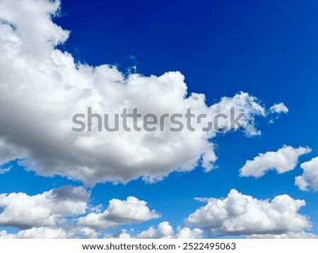Blue sky with billowy clouds