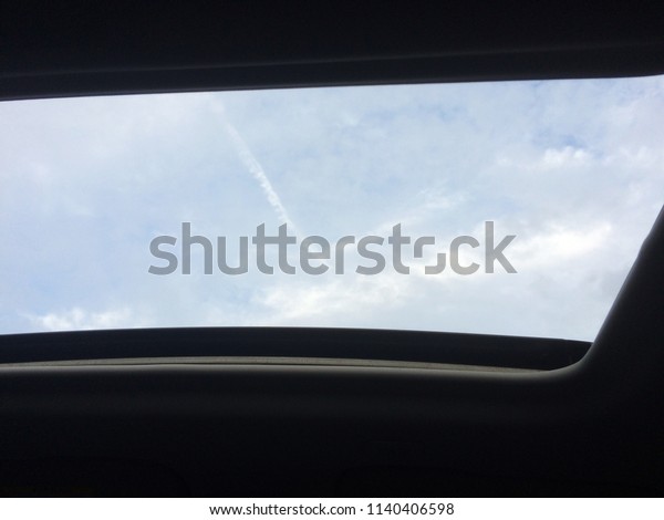 blue sky from car\'s sun\
roof