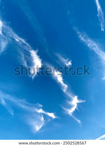 Blue sky with cloud wisps