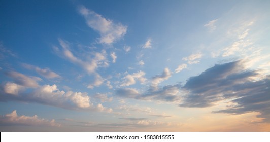 Blue Sky Clouds Background. Beautiful Landscape With Clouds And Orange Sun On Sky
