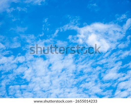 Blue sky with clouds background texture. Sky scape.