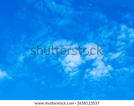 Blue sky with clouds background texture. Sky scape.
