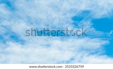 blue sky and clouds close up view from below.