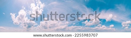 Blue sky with clouds. Cloudy sky background. Horizontal banner