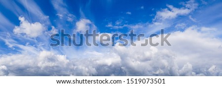 Blue sky with clouds. Epic sky landscape of looming fluffy clouds. Beautiful heaven in the village. Atmosphere, ozone layer protection, weather, precipitation