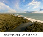 Blue sky with clouds over Bonita Beach in Florida from an aerial view in spring