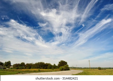 Blue Sky With Clouds Over The Road