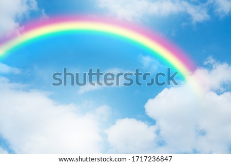 Blue sky and clouds with rainbow.
