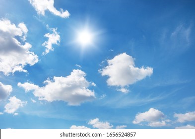 Blue Sky With Clouds And Sun.