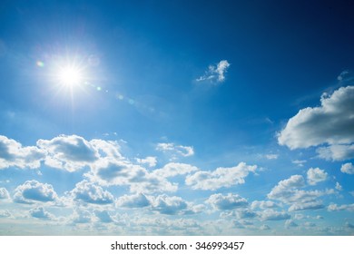 Blue Sky With Clouds And Sun