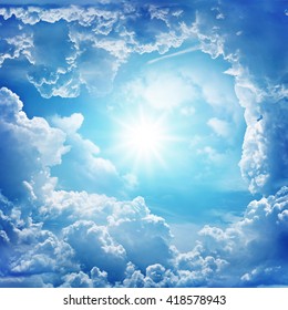 Blue sky with clouds and sun. - Shutterstock ID 418578943