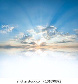 Blue sky with clouds and sun reflection in water with place for your text - Shutterstock ID 131890892