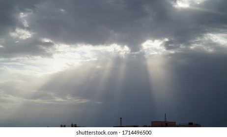 Blue sky with clouds and sun reflection. Sun and clouds