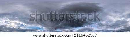 blue sky with dark beautiful clouds before storm in seamless hdri panorama 360 degrees angle view  with zenith for use in 3d graphics or game development as sky dome or edit drone shot