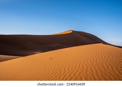 The blue sky and the desert seem to blend together - Shutterstock ID 2140914439