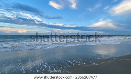 Blue Sky at dusk over ocean waves at Myrtle Beach