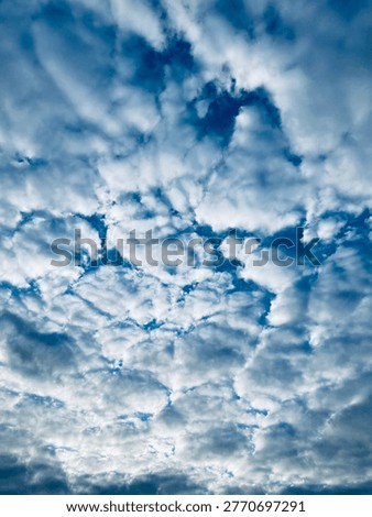 A blue sky with endless clouds