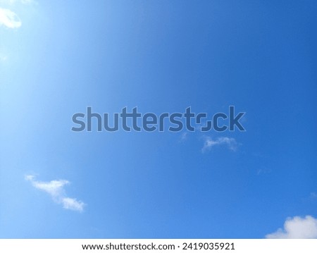 blue sky with few beautiful white clouds