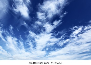 Blue sky with fleecy clouds, may be used as background