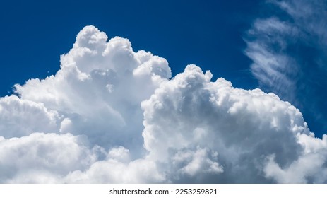 Blue sky fluffy white clouds on summer season bright clear skyline with beautiful cloudscape. Panorama blue sky clouds pattern on daylight with copy space. Cumulus cloudscape air climate sunny day - Shutterstock ID 2253259821